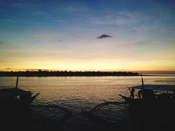 Scenic view of calm sea at sunset