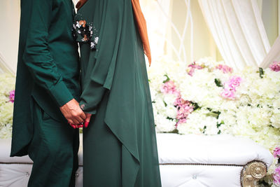 Couple hugging on their wedding. bride and groom holding hands.