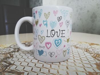 Close-up of coffee cup on table