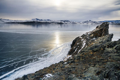 Scenic view of sea against sky during winter