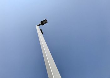 Low angle view of street light against clear blue sky