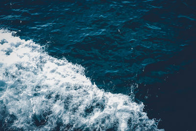 High angle view of water flowing over sea
