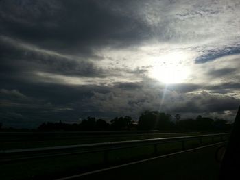 Scenic view of landscape against cloudy sky