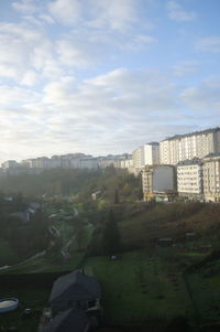 Buildings in city against sky