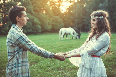 Couple holding hands in park