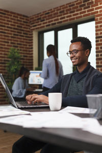 Smiling businessman working at office