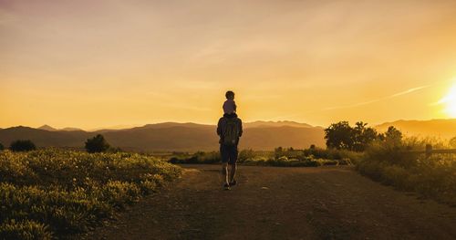 Silhouette of woman standing on landscape