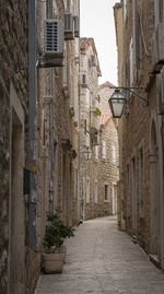 Footpath amidst buildings in town