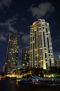 Low angle view of skyscrapers lit up at night