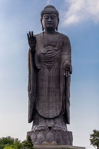 Low angle view of statue against sky