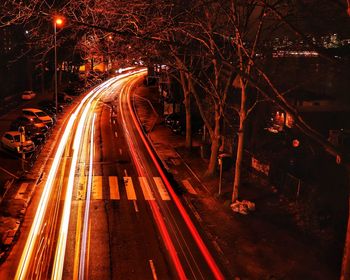 High angle view of light trails on road at night