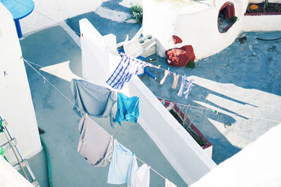 High angle view of clothes hanging on clothesline at building terrace
