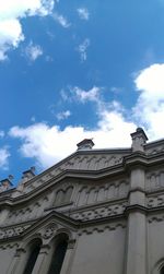 Low angle view of built structure against blue sky