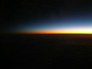 Scenic view of landscape against sky at night