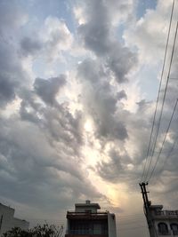 Low angle view of building against sky during sunset