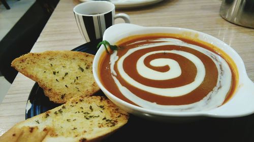 Close-up of cappuccino served on table