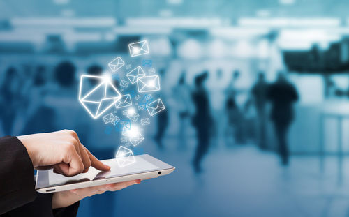 Midsection of man using mobile phone