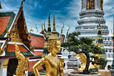 Statue of temple outside building