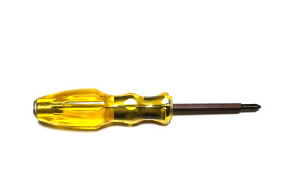 High angle view of yellow pen against white background