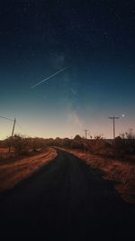 Road against sky at night