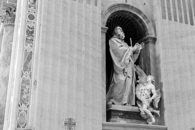 Statue of angel outside building