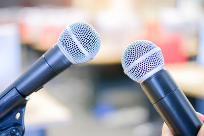 Close-up of microphones in hall