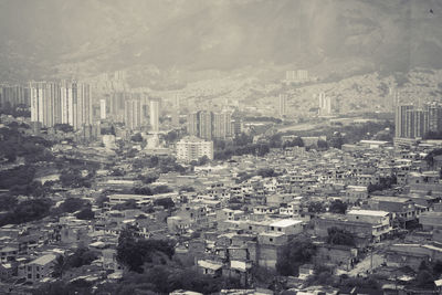 High angle view of city buildings against sky