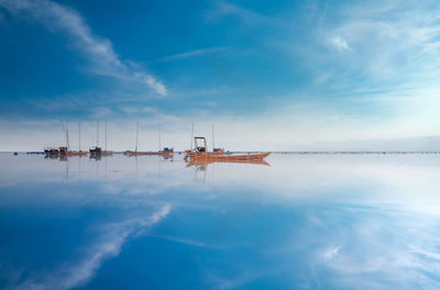 Scenic view of sea against blue sky