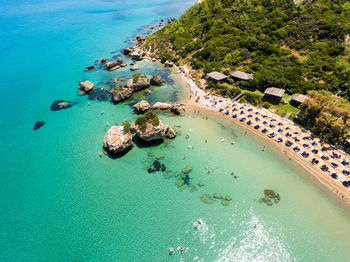 Aerial view of sea and landscape against sky