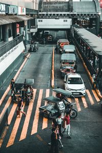 High angle view of people walking on road