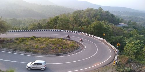 High angle view of car on road by trees