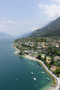 High angle view of bay and buildings against sky