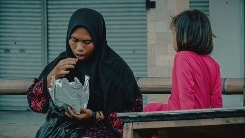 Full length of a woman looking at camera