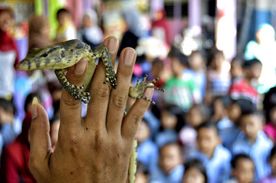 Close-up of hand holding blurred outdoors