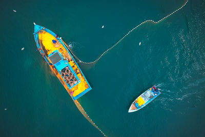 High angle view of ferris wheel in sea