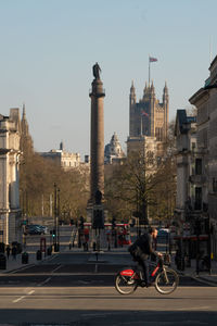 View of city buildings against clear sky