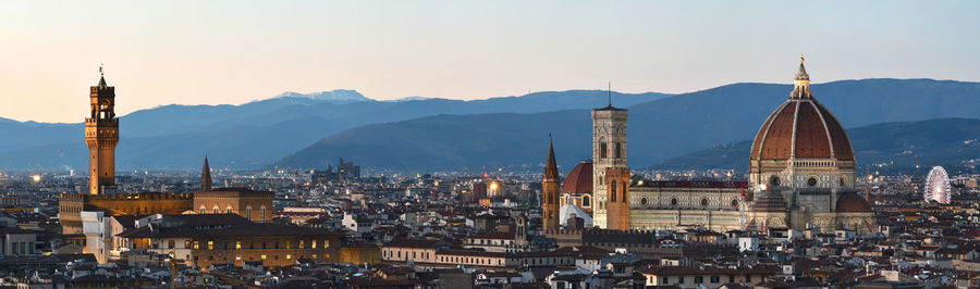 Panoramic view of townscape against mountain