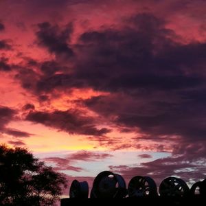 Silhouette trees against sky during sunset