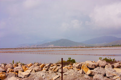 Scenic view of rocks and mountains against sky