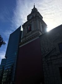 Low angle view of tower against sky in city