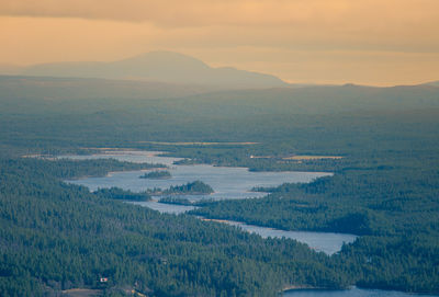 Scenic view of landscape against sky during sunset