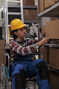 Rear view of man working at construction site