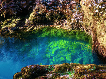 High angle view of rock formation in sea