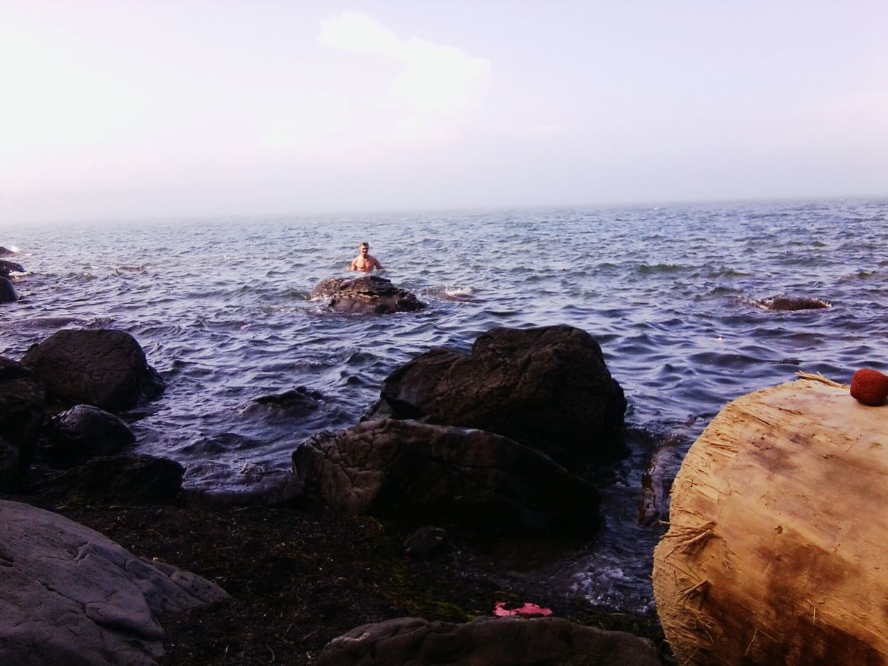 sea, water, rock - object, horizon over water, scenics, rock formation, beauty in nature, tranquility, rock, tranquil scene, shore, sky, nature, leisure activity, lifestyles, beach, cliff, idyllic