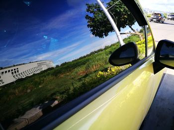 Close-up of car on road against sky