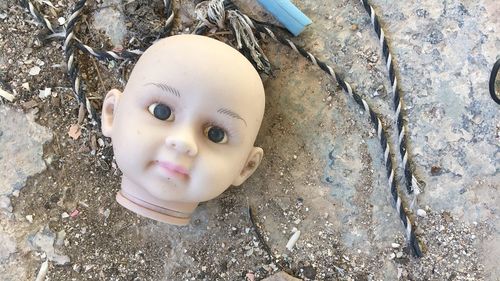 Close-up of broken doll 