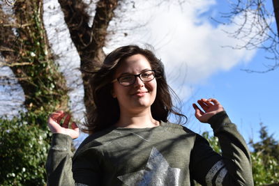 Portrait of smiling girl wearing eyeglasses in park