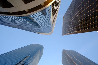 Low angle view of modern buildings against clear sky