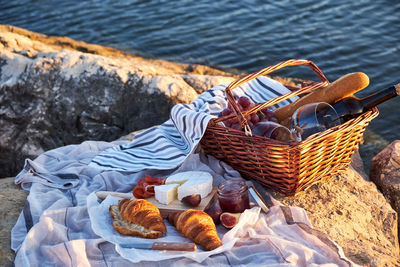 High angle view of food in basket by lake