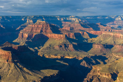 Aerial view of landscape with mountain range in background